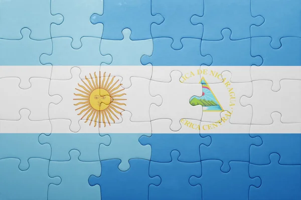 Puzzle with the national flag of nicaragua and argentina — Stock Photo, Image