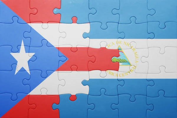 Puzzle mit der nationalen flagge von nicaragua und puerto rico — Stockfoto