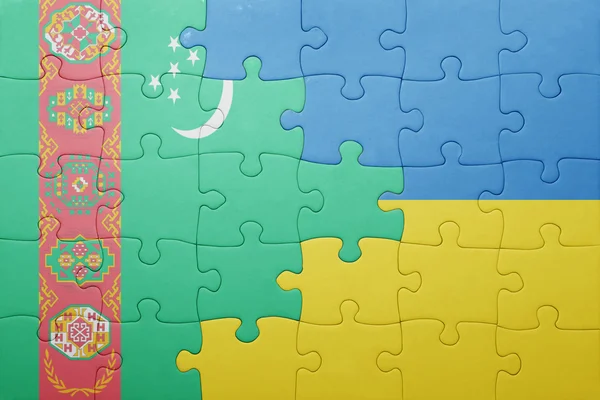 Puzzle com a bandeira nacional da Ucrânia e do Turquemenistão — Fotografia de Stock