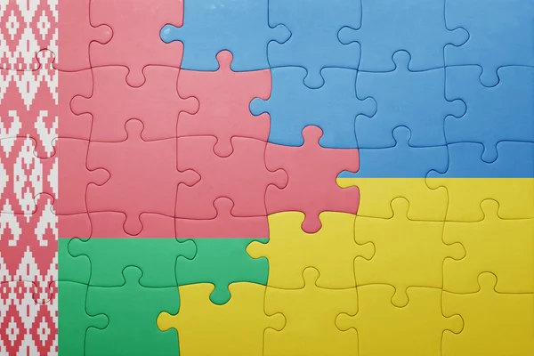 Puzzle con la bandiera nazionale di Ucraina e Bielorussia — Foto Stock