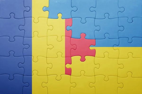 Puzzel met de nationale vlag van Oekraïne en Roemenië — Stockfoto