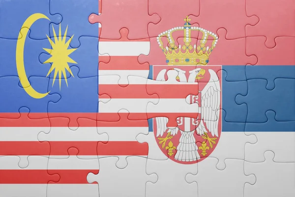 Puzzle with the national flag of malaysia and serbia . concept — Stock Photo, Image