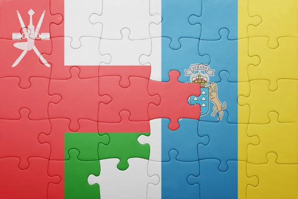 Puzzle mit der Nationalflagge der Kanarischen Inseln und oman — Stockfoto