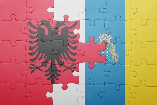 Puzzle s národní vlajka Kanárských ostrovů a Albánie — Stock fotografie