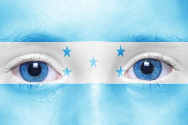 Human's face with honduran flag — Stock Photo, Image