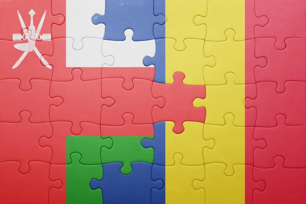 Puzzle mit der Nationalflagge von Italien und Rumänien — Stockfoto