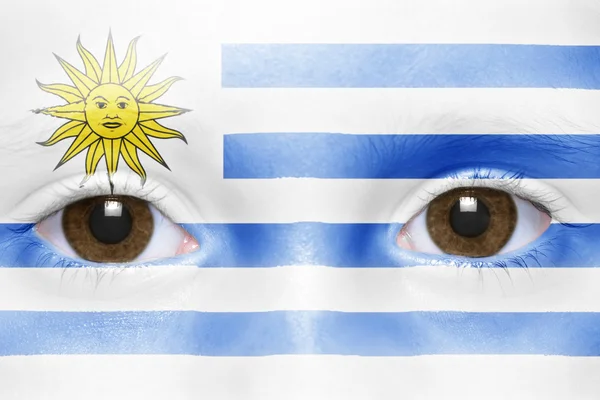 Rostro humano con bandera uruguaya — Foto de Stock