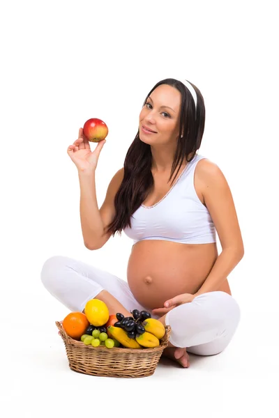 Nutrição adequada durante a gravidez. Vitaminas e frutas. Mulheres grávidas que comem maçã — Fotografia de Stock