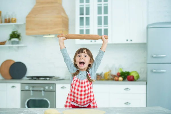 Cute Little Girl Pigtails Plaid Apron Kneads Pizza Dough Her — Stock Photo, Image