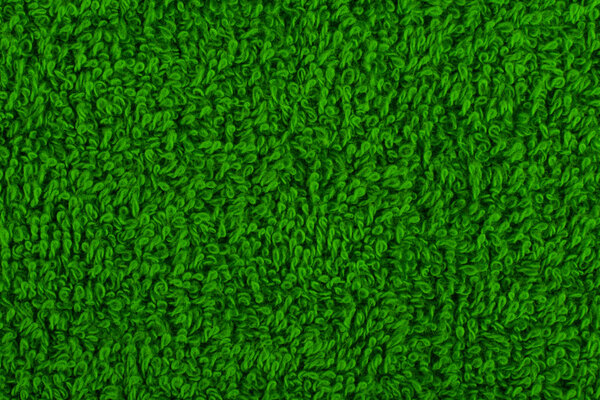 Background of green terry towels.