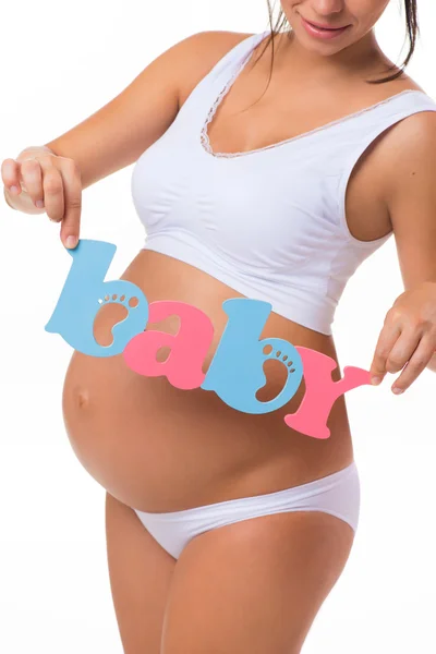 Gravidez. Maternidade. Texto azul e rosa Bebê na barriga grávida. Gémeos, raparigas ou rapazes . — Fotografia de Stock