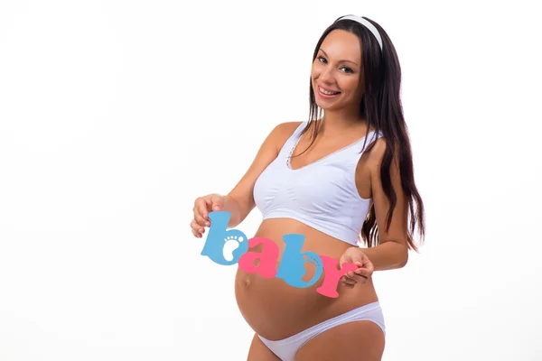 Mujer embarazada sonriente esperando gemelos, niña y niño . — Foto de Stock