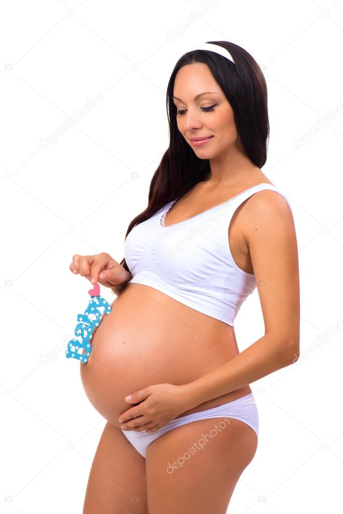 Happy pregnancy. Pregnant woman waiting for the firstborn. Blue label Baby for newborn boy  near tummy