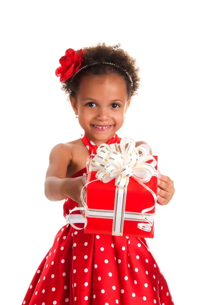 Smiling girl with curls hair give a  gift box in hands. Happy  New Year and christmas holidays — Stock Photo, Image