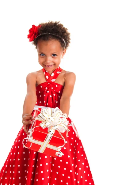 Smiling girl with curls hair give a  gift box in hands. Happy  New Year and christmas holidays — Stock Photo, Image