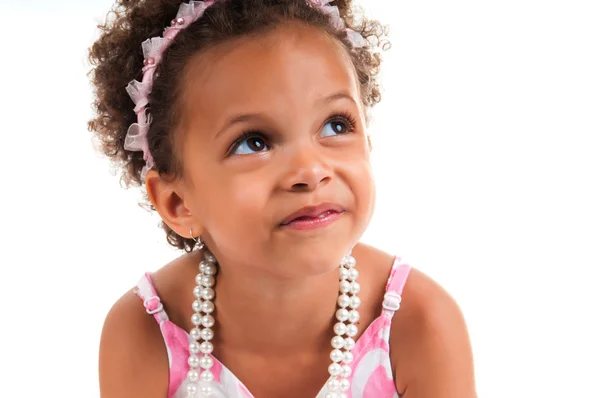 Close-up portrait of mulatto young girl with curly hair. Smiling face. Happy childhood. — Stok fotoğraf