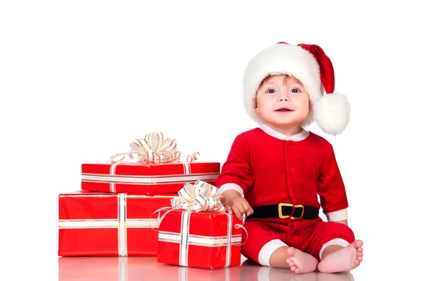 Cheerful little Santa Claus with presents. Isolated on white bac — Stock Photo, Image