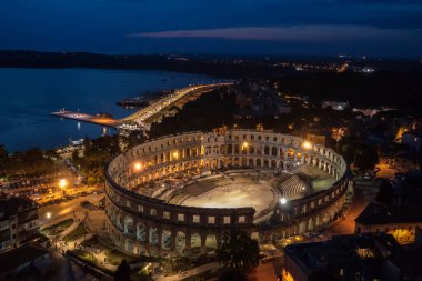 an aerial view of Pula aphitheatre by night, Istria, Croatia clipart