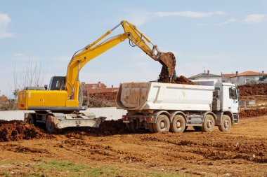 Excavator and tipper truck clipart