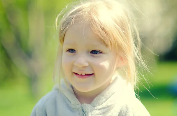 Cute little girl in the sunshine — Stock Photo, Image