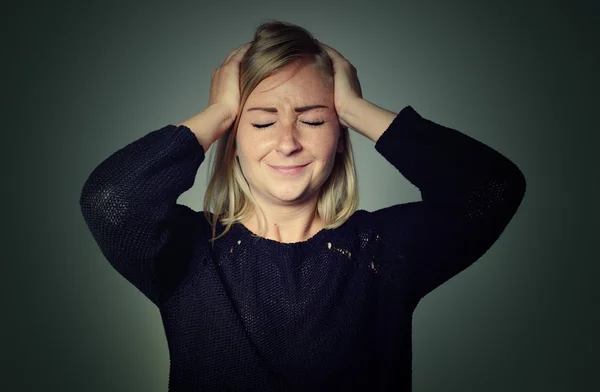 Woman with a headache in room — Stock Photo, Image