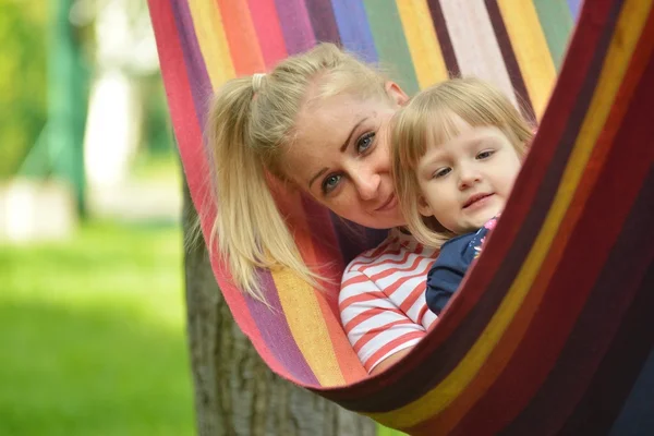 Mother and daughter on hammock — Stock Photo, Image