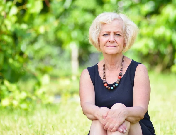 Mature woman in garden — Stock Photo, Image