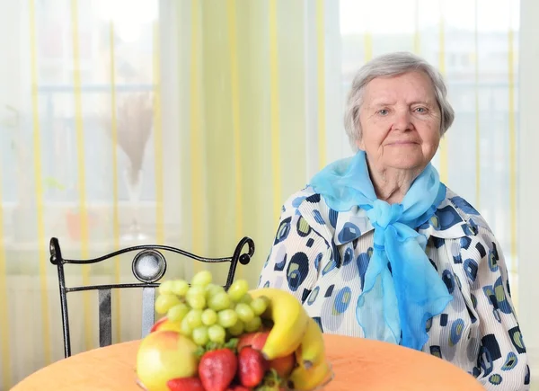 Senior happy woman in her home — Stock Photo, Image