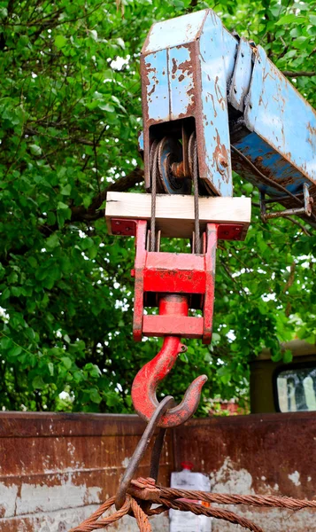 Red rusty old metal hook the manipulator — Stock Photo, Image