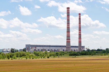 building power plants against the blue sky