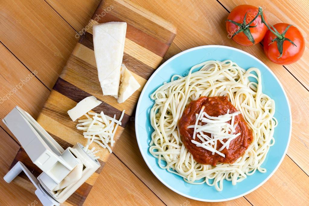 Pasta press with gruyere cheese and spaghetti