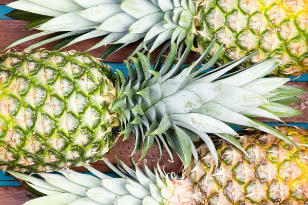 Three pineapple fruits close together — Zdjęcie stockowe