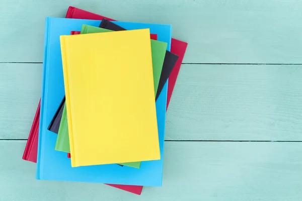 Offset stack of multicolored hardcover books — Stock Photo, Image