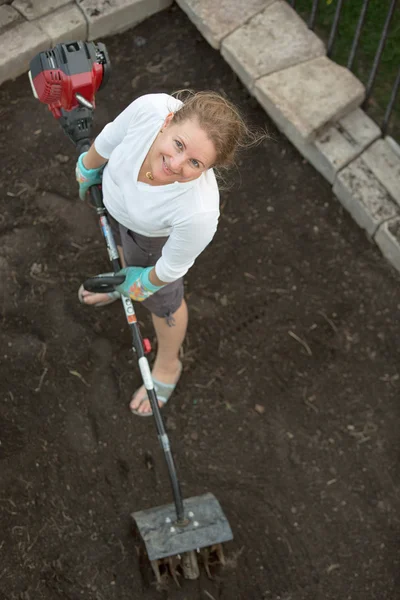 Attractive middle-aged woman gardening — Stock Photo, Image