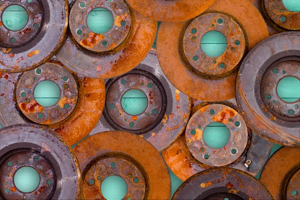 Conceptual image of overlaid rusty brake rotors — Stock Photo, Image