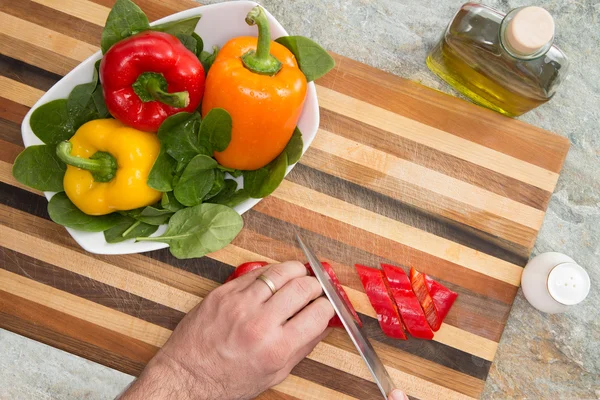 Cutting Fresh Bell Peppers on Top of Wooden Board — Stock Photo, Image