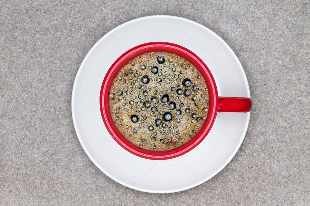 Aerial View of Black Coffee in Red Cup on a Plate