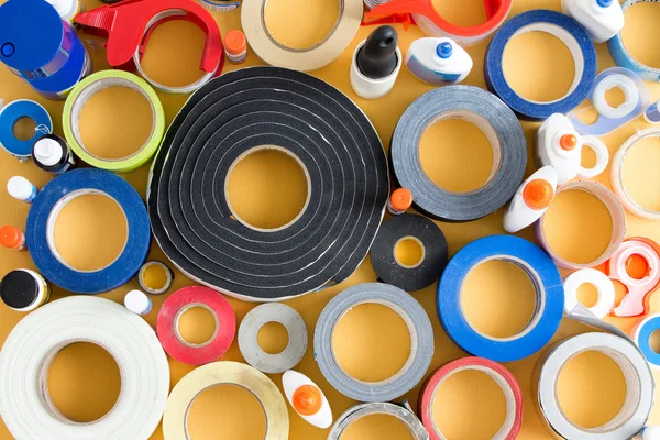 Striking abstract pattern of glue pots and tape — Stock Photo, Image