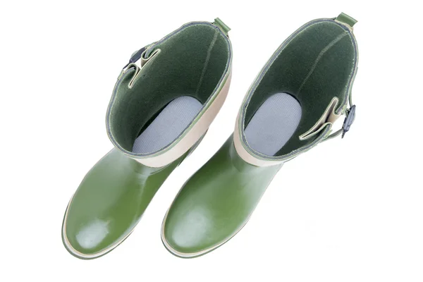 Looking inside a pair of green garden boots — Stock Photo, Image