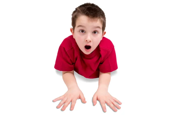 Surprised Cute Male Kid Lying on his Stomach — Stock Photo, Image