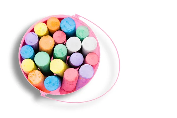 Pink bucket of colorful chalk crayons — Stock Photo, Image