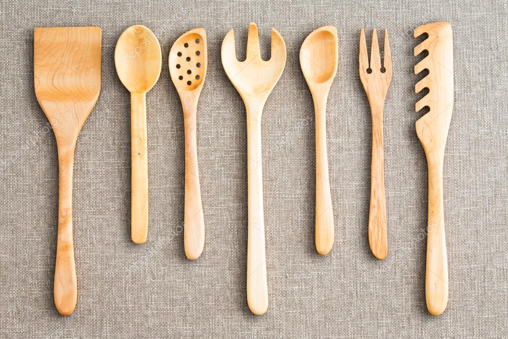 Row of assorted wooden kitchen utensils Stock Photo by ©oocoskun 68950495