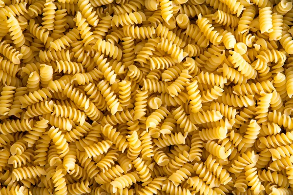 Background texture of Italian rotini pasta — Stock Photo, Image