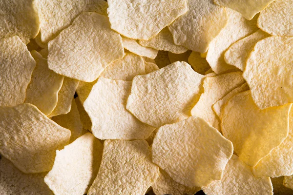 Achtergrondstructuur van oven gebakken aardappels, chips — Stockfoto
