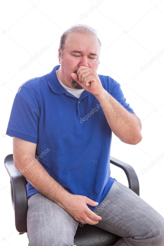 Sick Man Sitting on a Chair Suffering From Cough