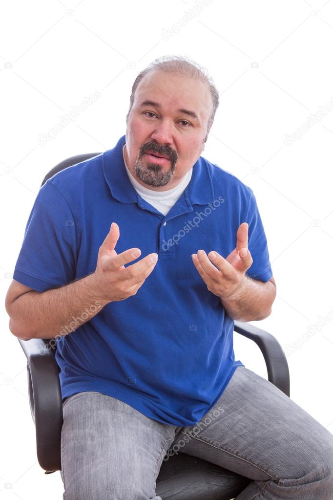 Bearded Guy Sitting on Chair Explaining Something