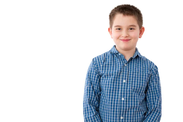 Menino de 10 anos com sorriso travesso no branco — Fotografia de Stock