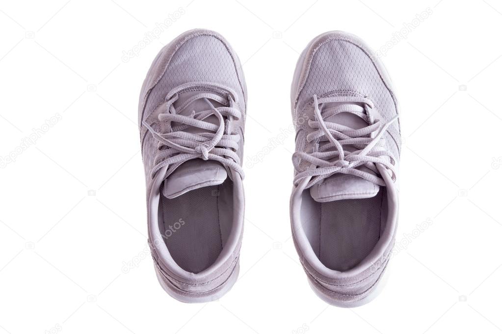 Pair of Worn White Sneakers on White Background