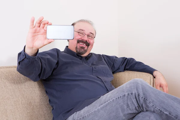 Happy man taking a selfie for his friends — Stock Photo, Image