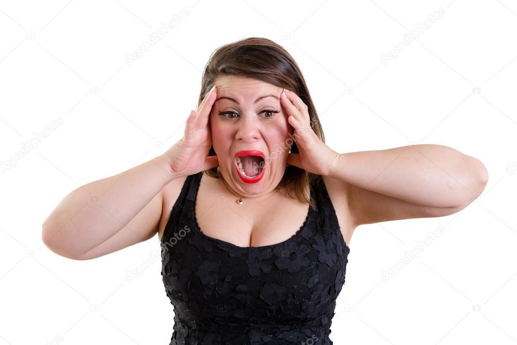 Terrified woman holding her head with both hands
